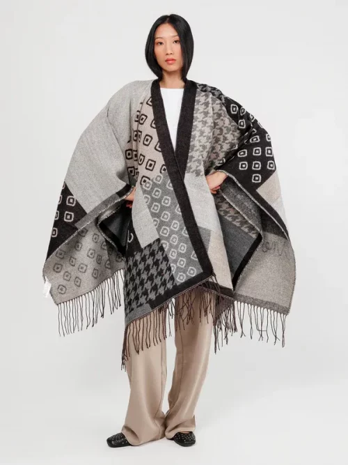 Poncho de Anekke con flecos negro y beige
